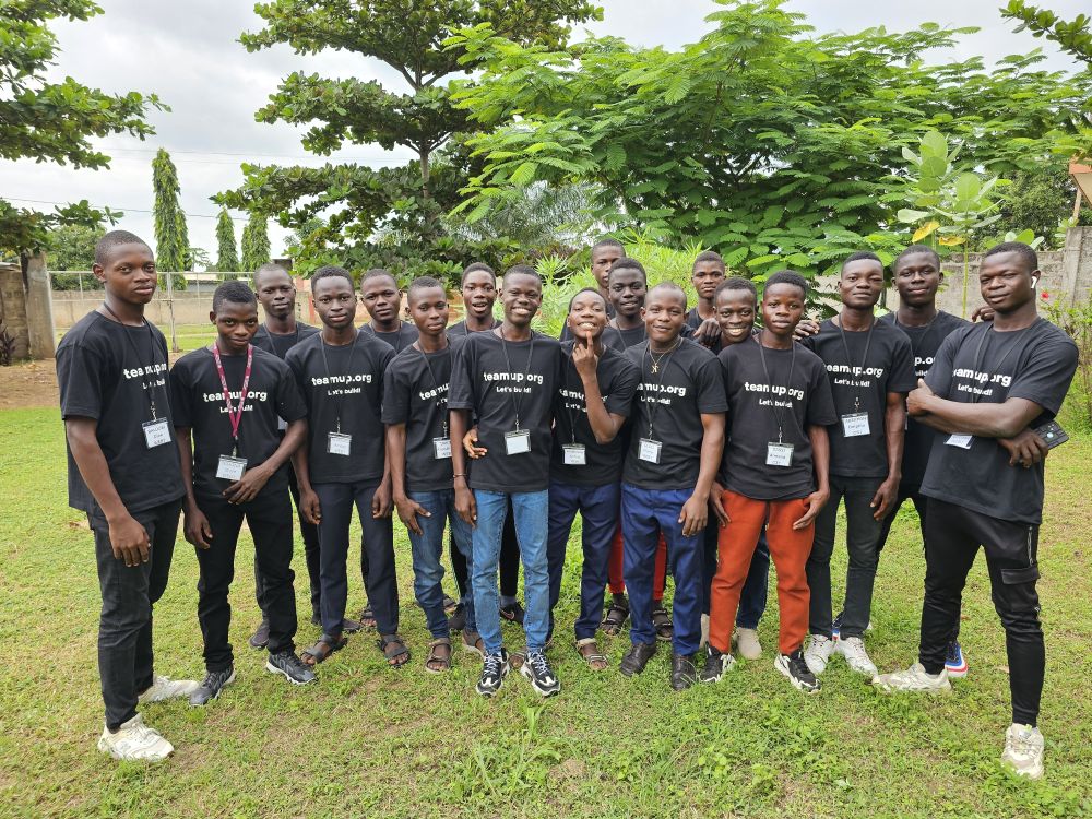 A whole cohort together, badges and Teamup t-shirts