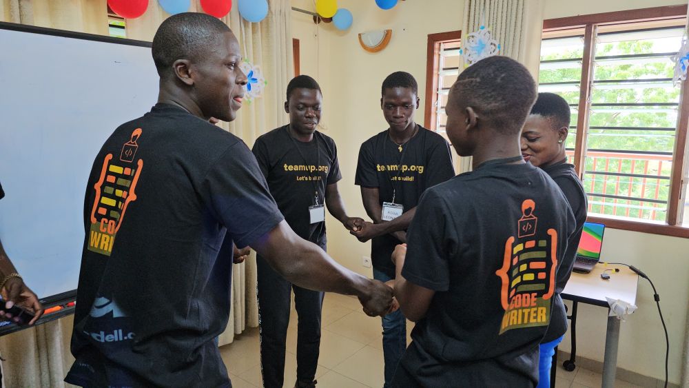 A handshake between students, on a milestone day at the Centre
